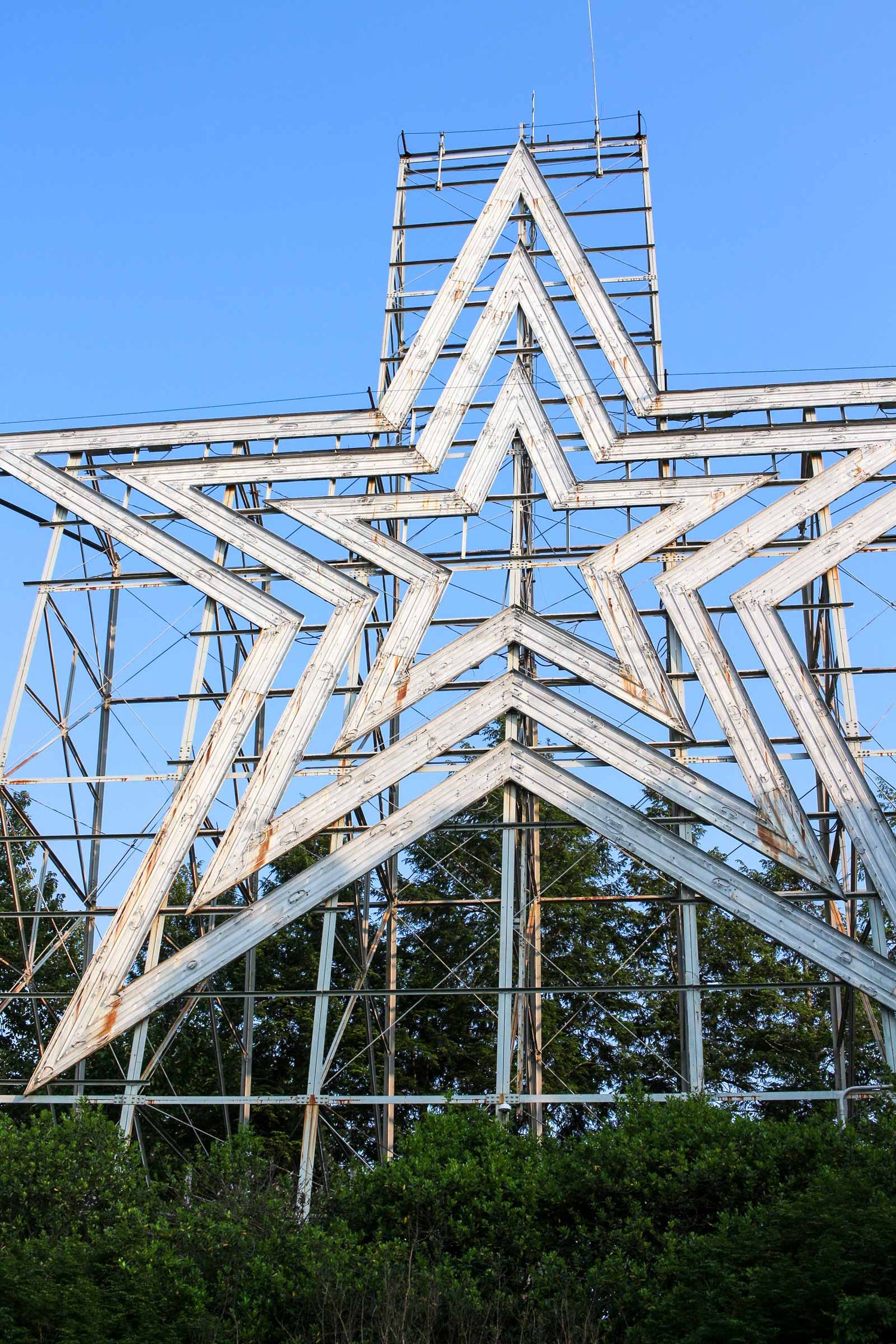 A close-up view of the Mill Mountain Star in Roanoke, Virginia. This iconic structure is a central symbol in the "Letting It Shine" collection by Roanoke Lifestyle, commemorating the star's 75th anniversary.